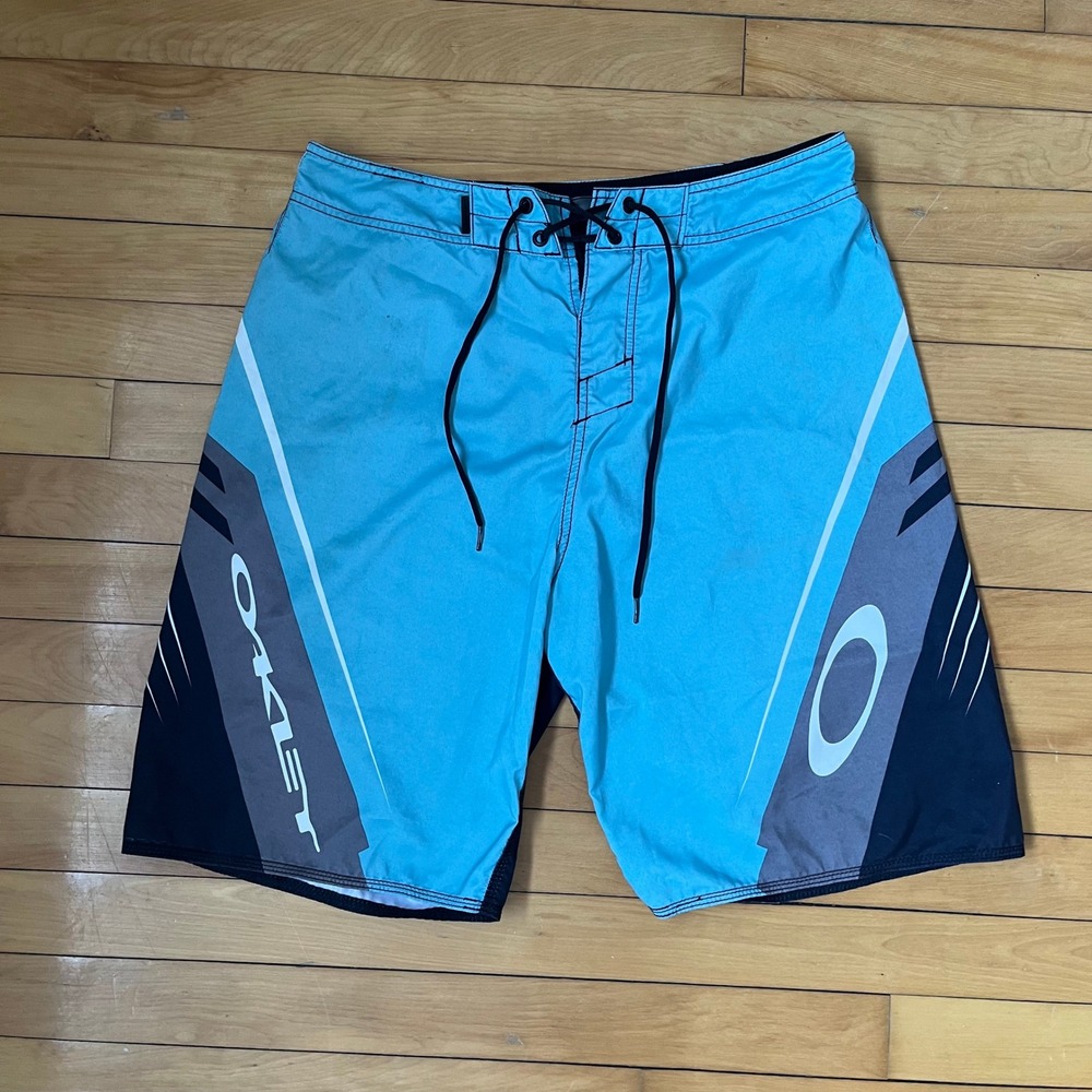 Oakley Mens Board Shorts Blue Black Graphic Swim Trunks Size 34 RN96548